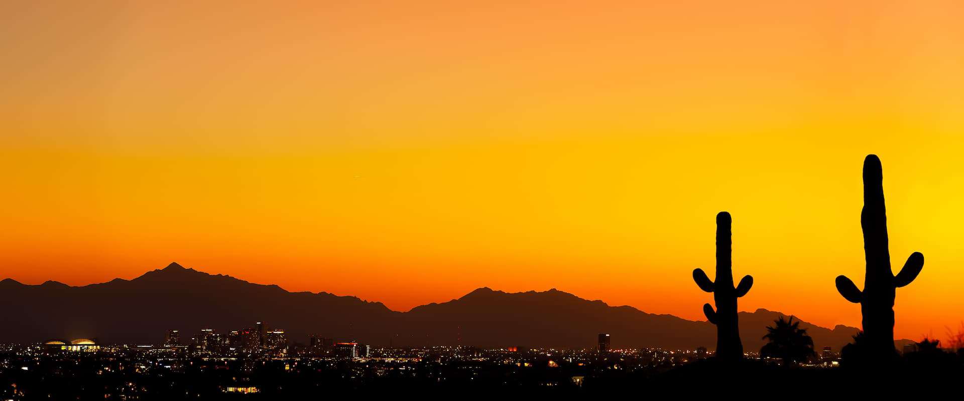 Sunset in Tuscon, Arizona overlooking the city lights.